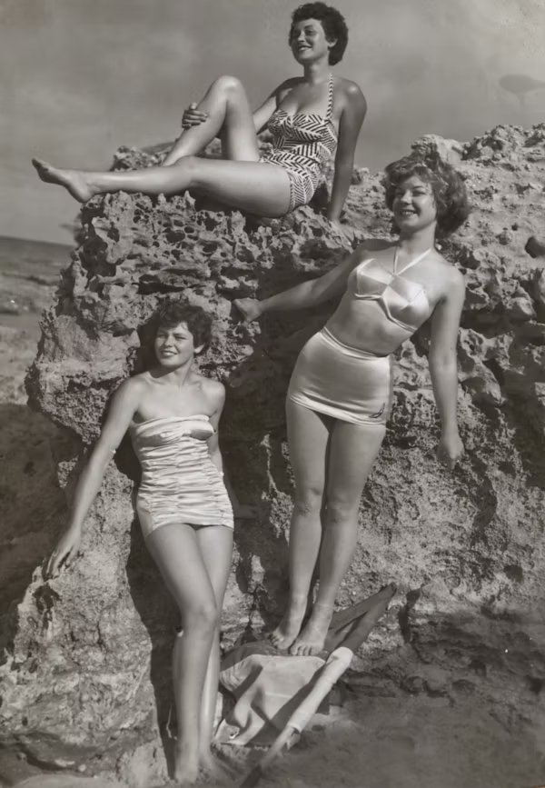Three women at the beach, 1950s